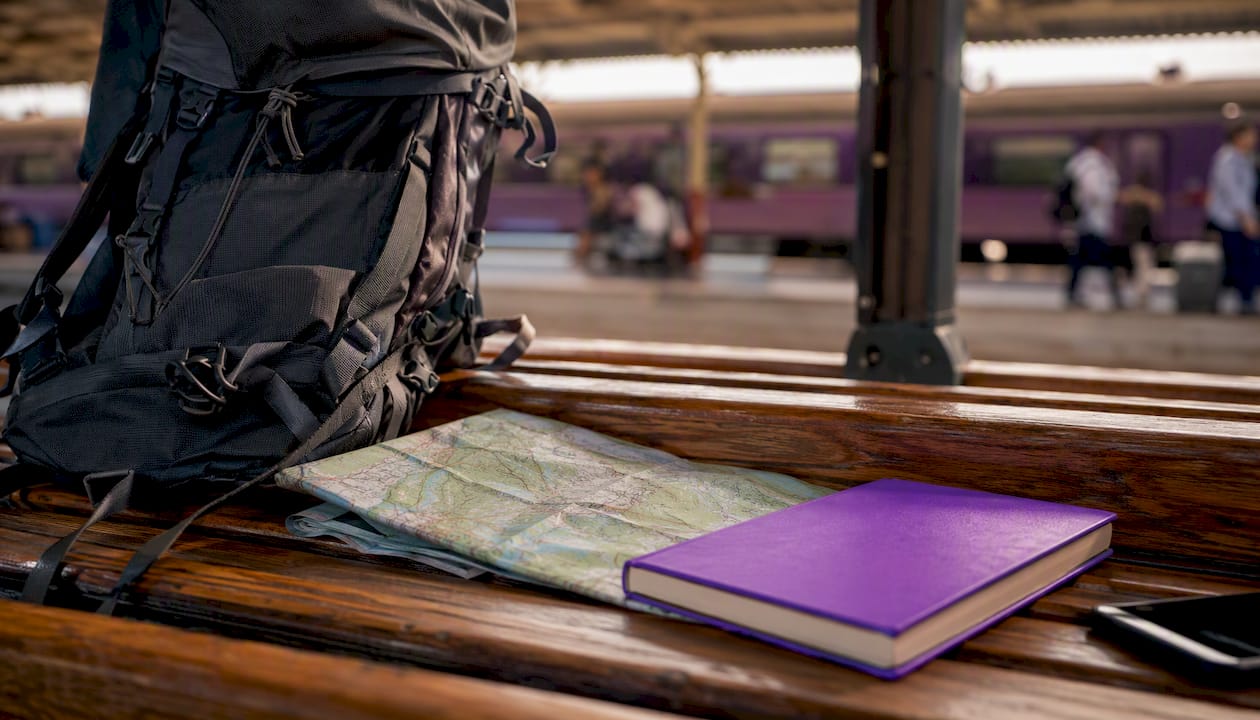 Backpack and map symbolizing ESL teaching abroad